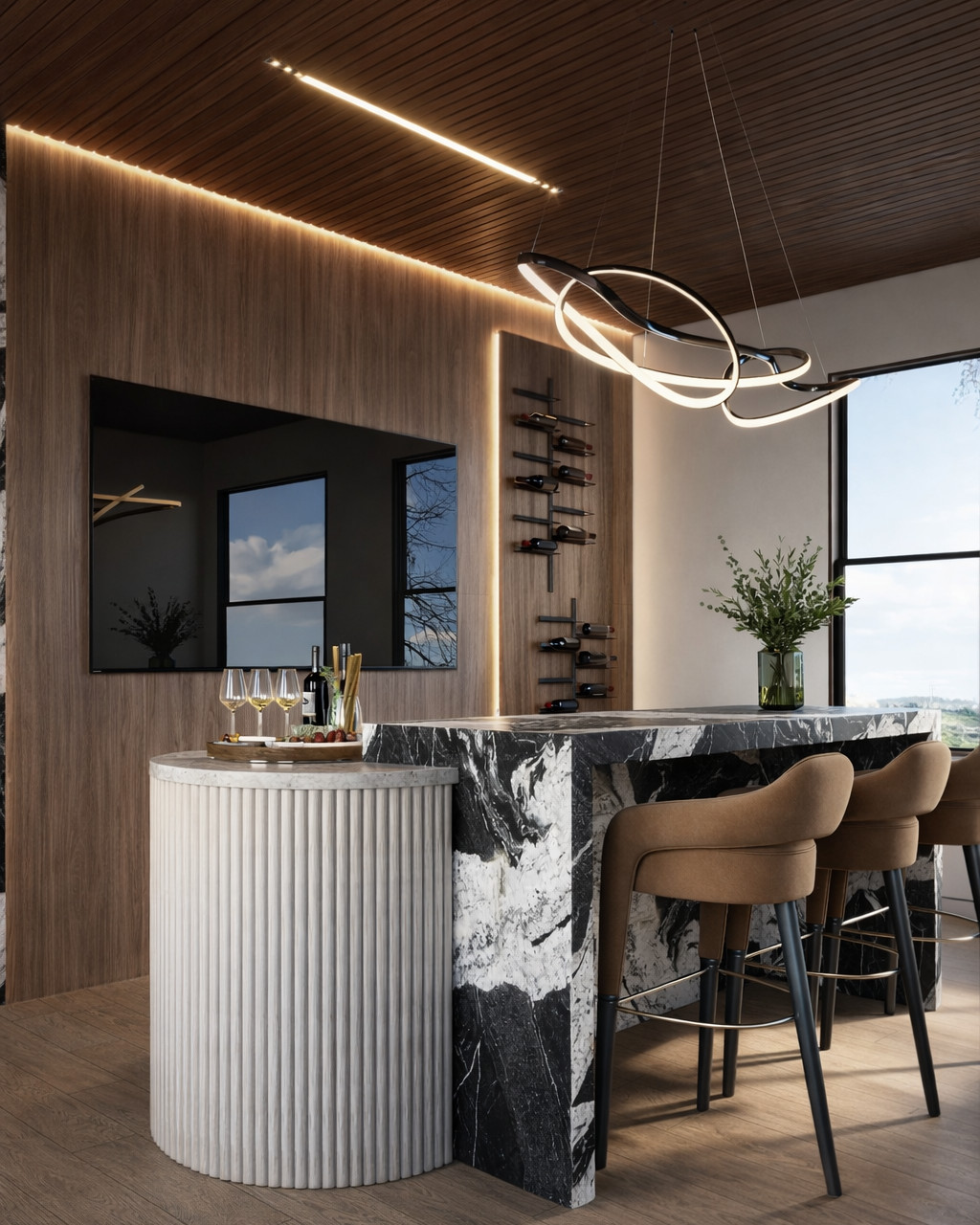 Home bar with a black and white marble counter, a round fluted plaster base, tan leather stools, a walnut slat ceiling with a linear light, a wall wine rack and a sculptural ribbon pendant.
